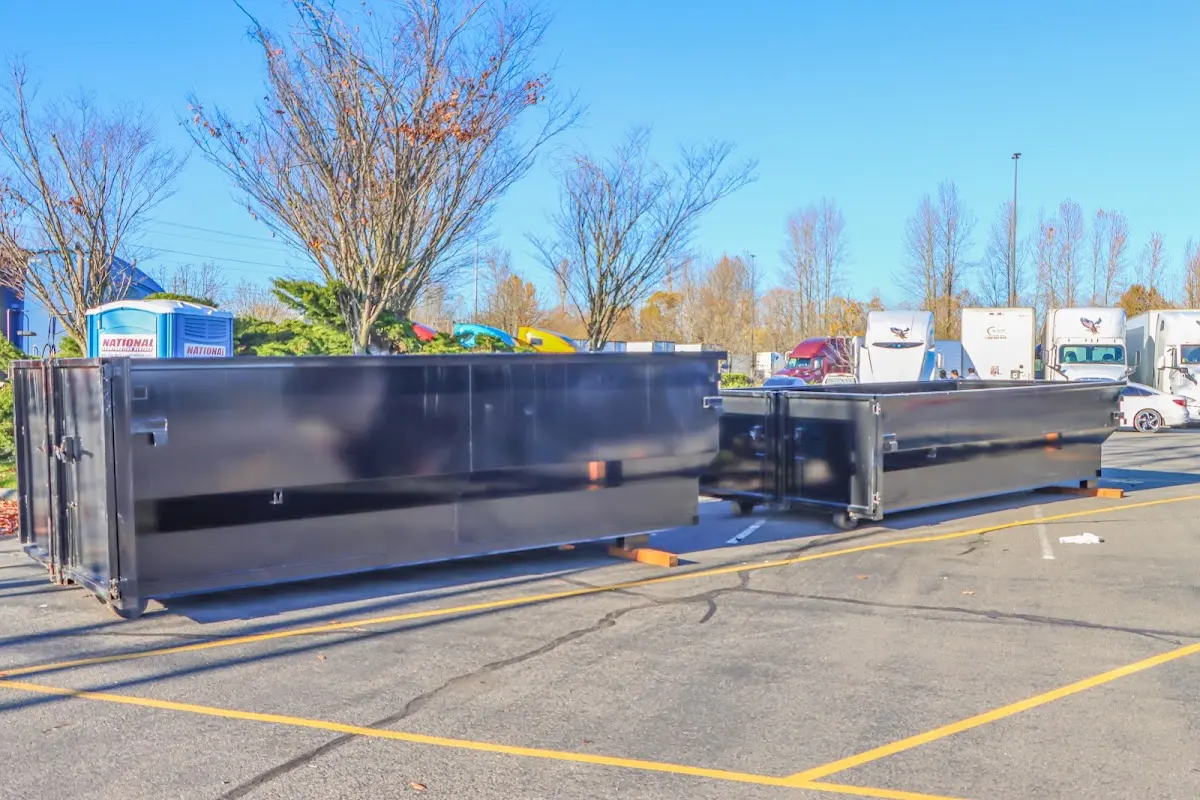 Professional dumpster rental service with roll-off container on residential driveway in Lochmoor Waterway Estates